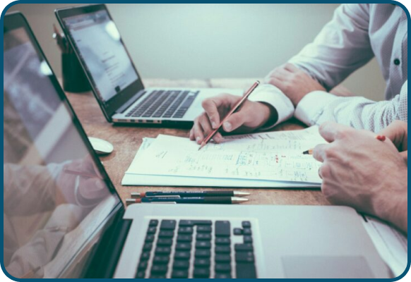 a professional work setting, often representing business collaboration, financial planning, or data analysis