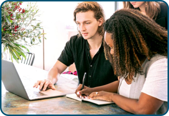 a man and a woman collaborating on a project in a professional setting