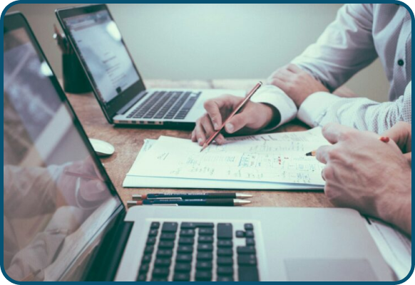 a professional work setting, often representing business collaboration, financial planning, or data analysis